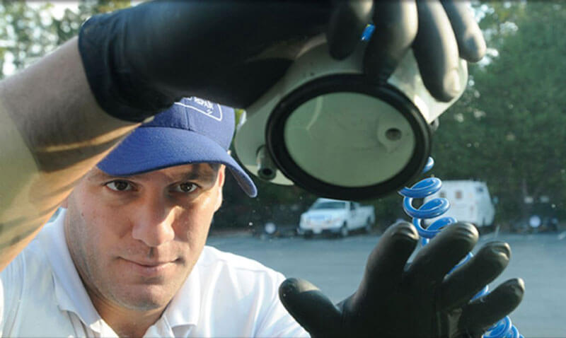 A professional repairing a cracked windshield